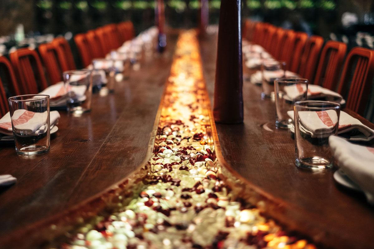Close-up of the illuminated petal-and-stone table inlay