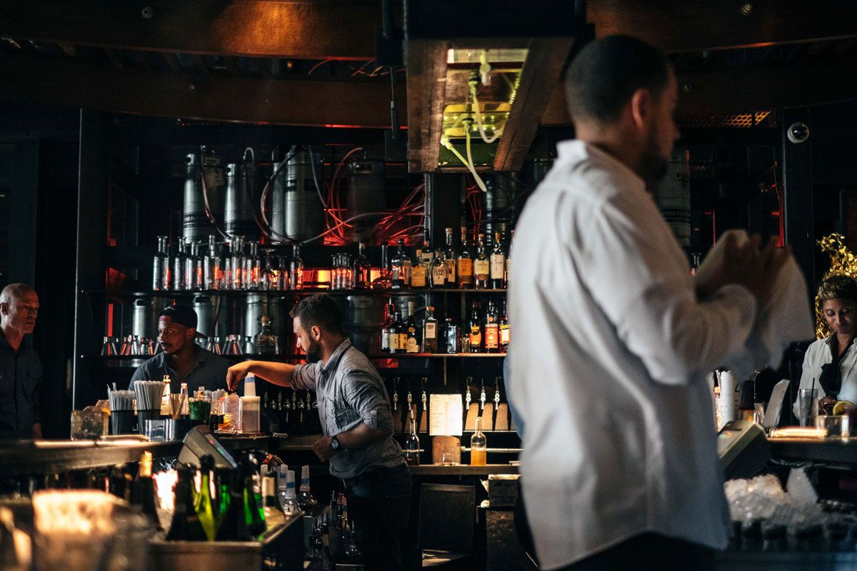 Bartenders at work behind the main bar