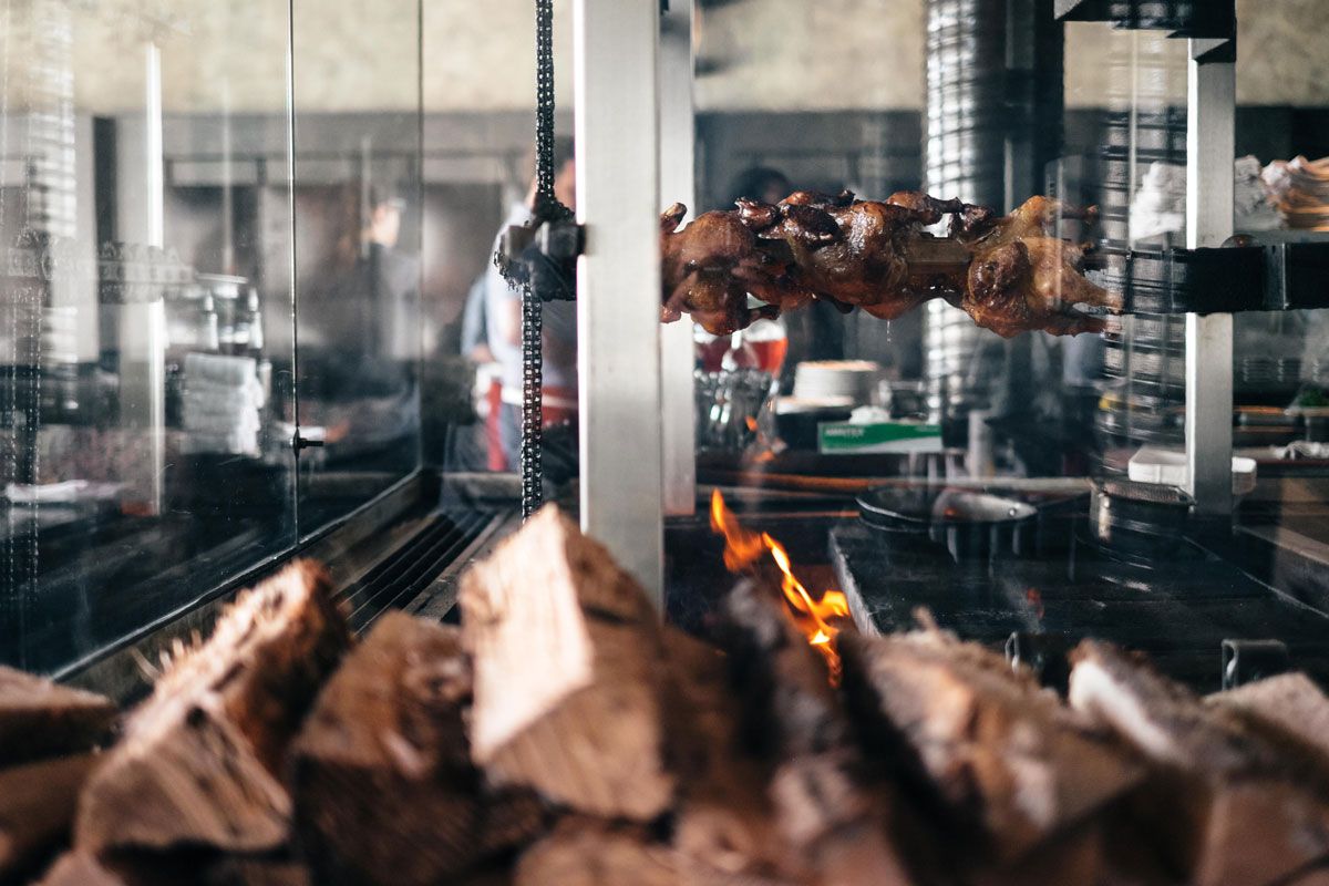 Wood-fired rotisserie char-grill in the open kitchen